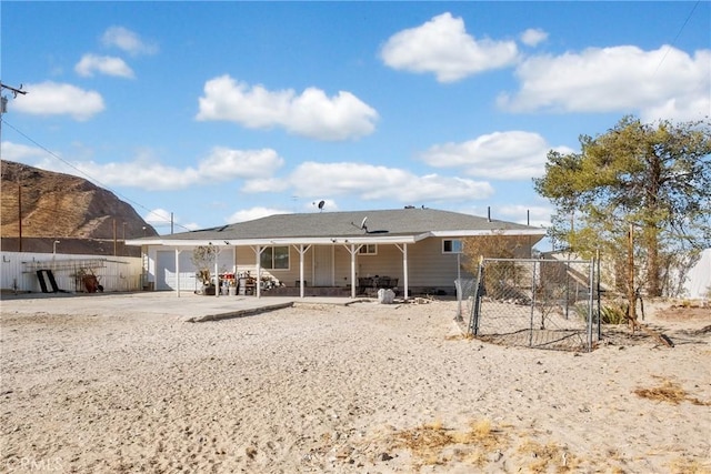 back of house with a patio area