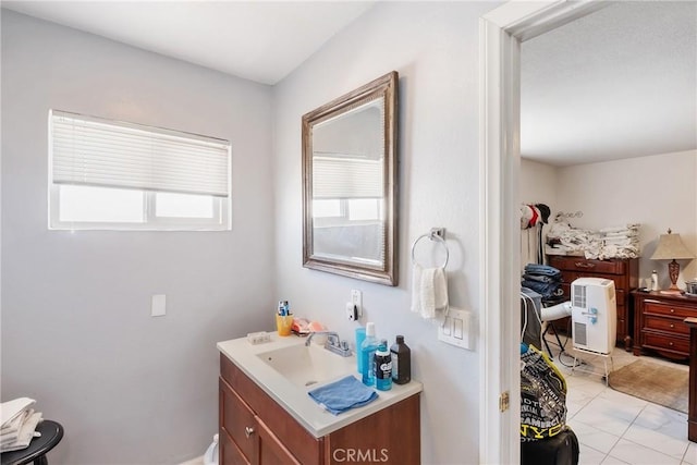 bathroom with tile patterned flooring and vanity