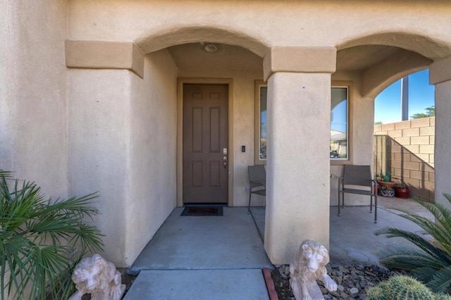 entrance to property featuring a patio