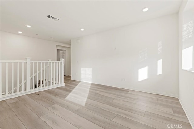 unfurnished room featuring light hardwood / wood-style flooring