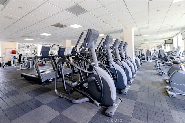 workout area featuring a paneled ceiling