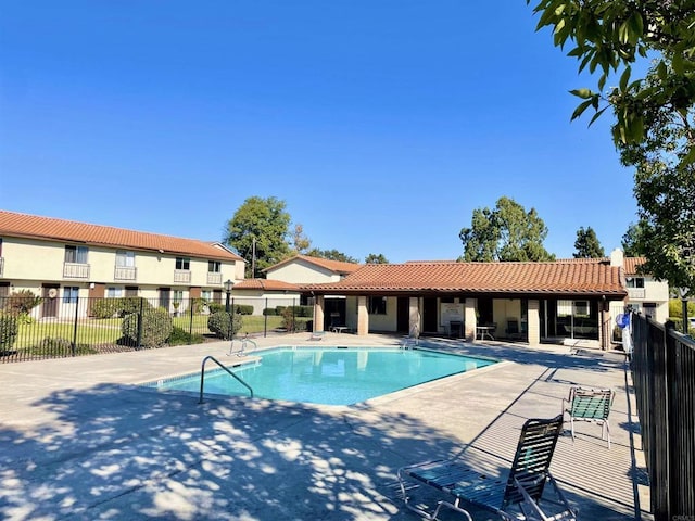 view of swimming pool with a patio