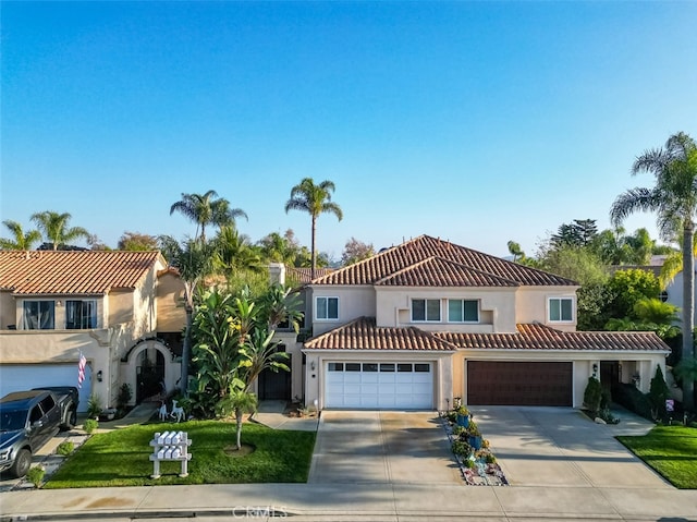 mediterranean / spanish house with a garage