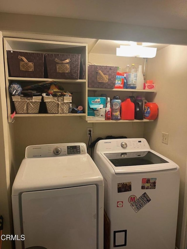 laundry room featuring washing machine and dryer