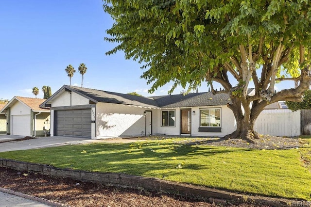 ranch-style home with a front lawn and a garage