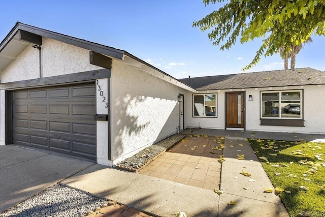 ranch-style house featuring a garage