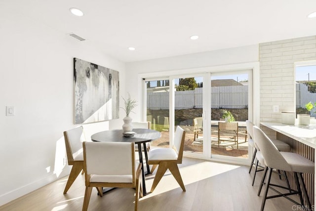 dining room with light wood-type flooring