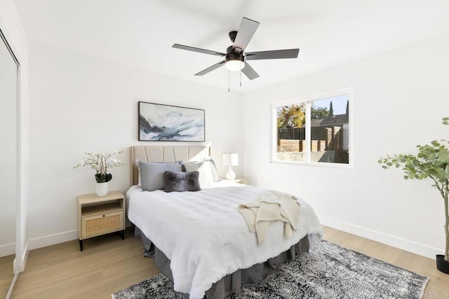 bedroom featuring ceiling fan and light hardwood / wood-style floors