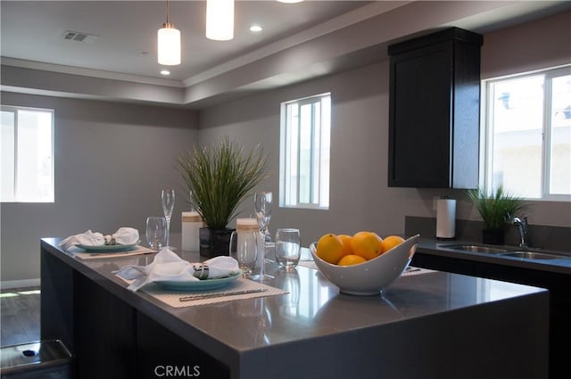 kitchen featuring sink and hanging light fixtures