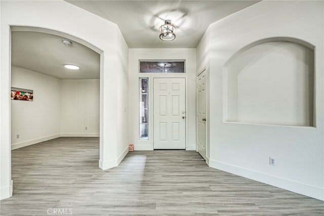 entrance foyer with light hardwood / wood-style flooring