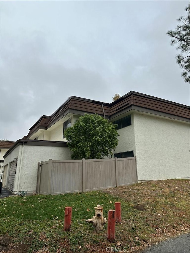 view of side of property with a garage