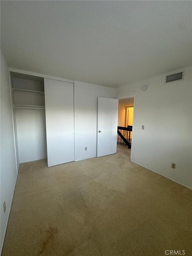 unfurnished bedroom featuring a closet