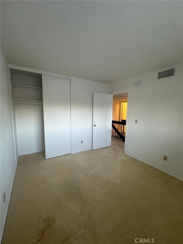 unfurnished bedroom with a closet