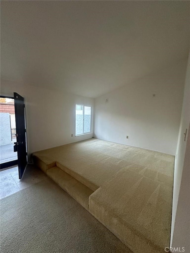 spare room with light carpet