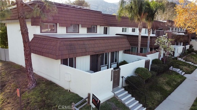 view of building exterior with a mountain view