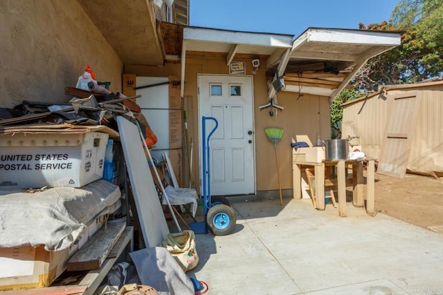 doorway to property with a patio area