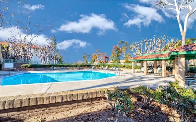 view of swimming pool with a patio area