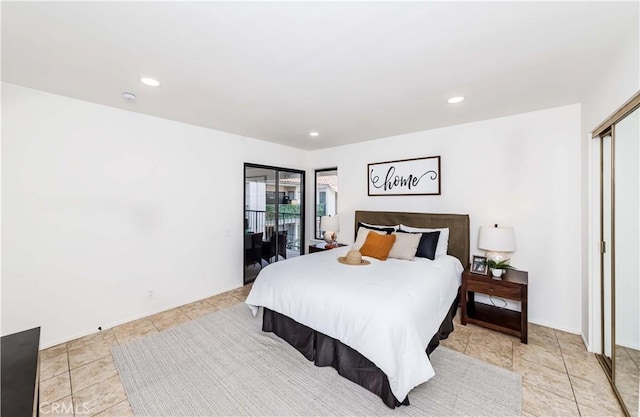 tiled bedroom featuring access to exterior