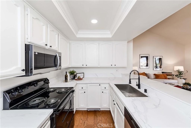 kitchen featuring appliances with stainless steel finishes, sink, and white cabinetry