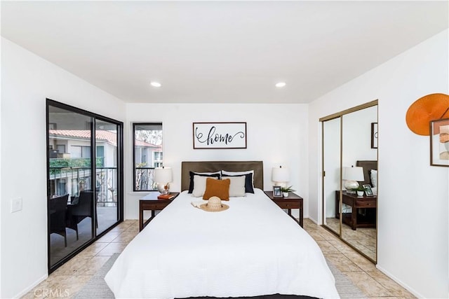 bedroom featuring a closet, light tile patterned floors, and access to outside