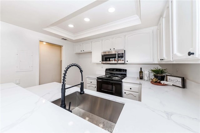 kitchen with black range with electric cooktop, white cabinets, a raised ceiling, and sink