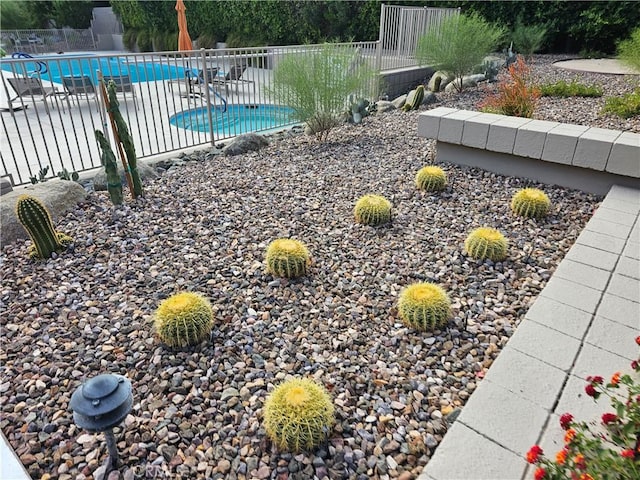 exterior space with a patio area and a fenced in pool