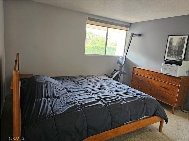 carpeted bedroom with a textured ceiling