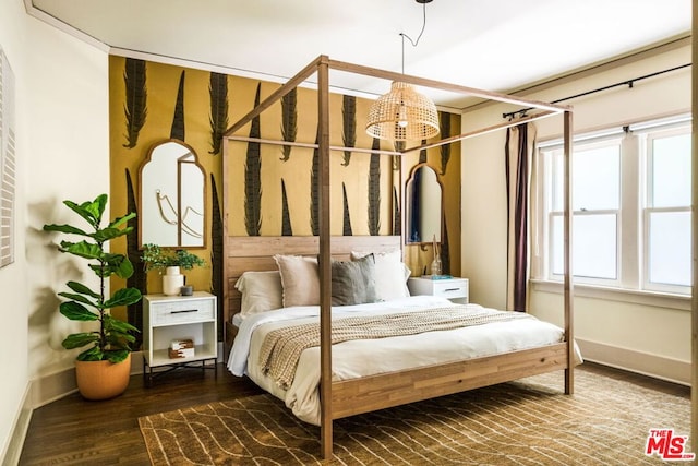 bedroom with wood-type flooring