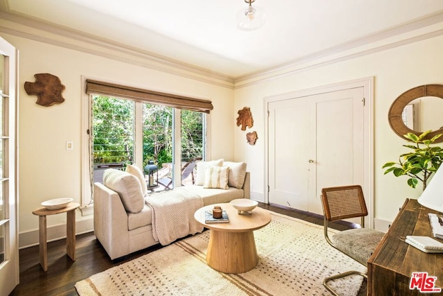 living room featuring dark hardwood / wood-style flooring and ornamental molding