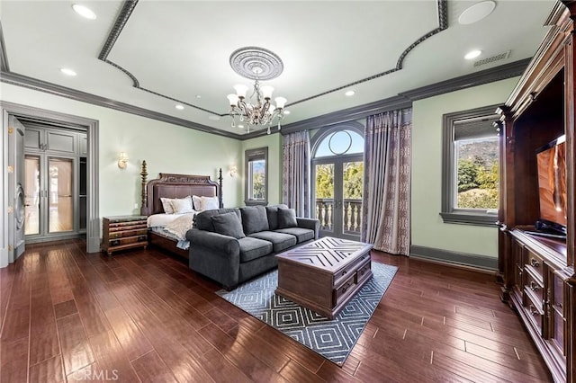 bedroom with an inviting chandelier, french doors, dark wood-type flooring, and multiple windows