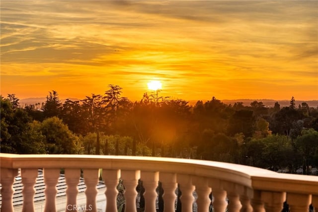 view of balcony at dusk