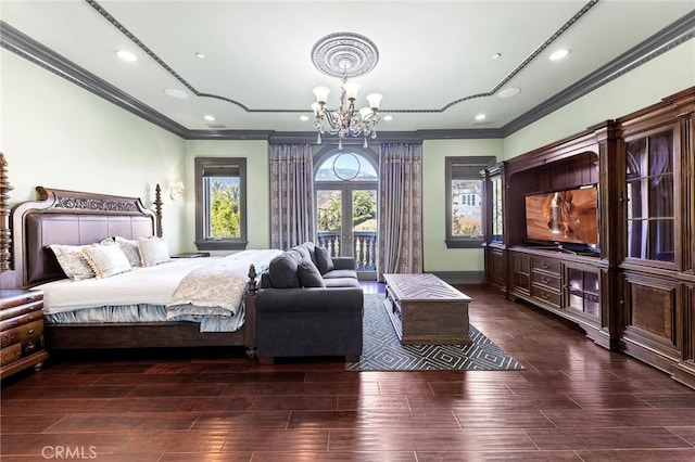 bedroom with crown molding, dark hardwood / wood-style floors, and a notable chandelier