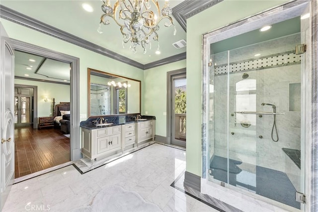 bathroom featuring hardwood / wood-style floors, vanity, crown molding, a notable chandelier, and a shower with shower door