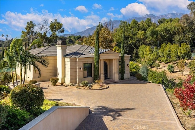 view of front of home featuring a mountain view