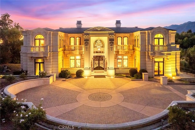 view of front of property with a balcony