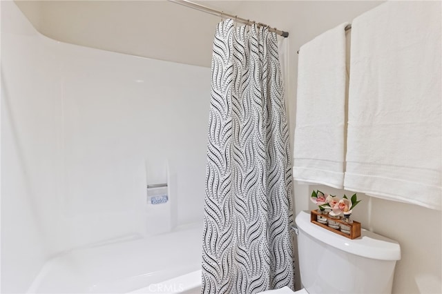 bathroom with toilet and shower / tub combo
