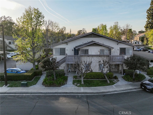 81 Smokestone Unit 12, Irvine, CA 92614 - view of front of home with stucco siding and stairs