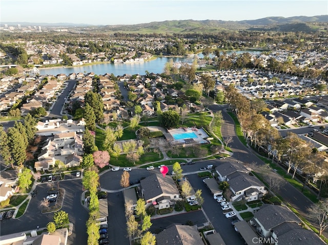 bird's eye view featuring a residential view and a water and mountain view