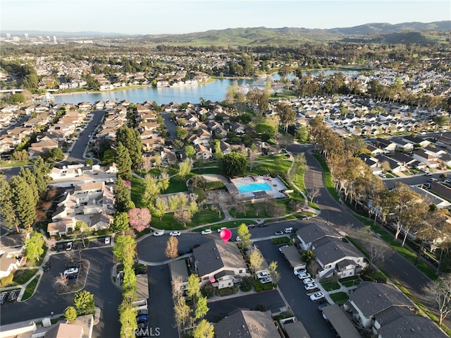 81 Smokestone Unit 12, Irvine, CA 92614 - aerial overview of property's location with nearby suburban area and a water and mountain view