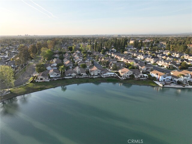 bird's eye view featuring a residential view and a water view