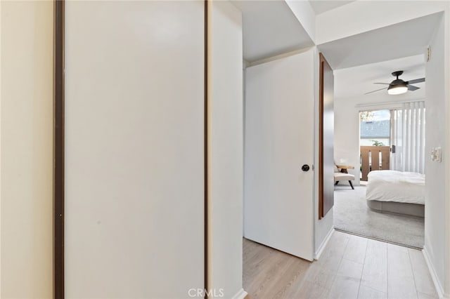 81 Smokestone Unit 12, Irvine, CA 92614 - hall featuring light wood finished floors and baseboards