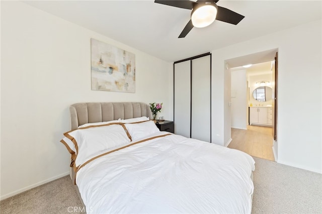 81 Smokestone Unit 12, Irvine, CA 92614 - bedroom with light colored carpet, ceiling fan, and a closet