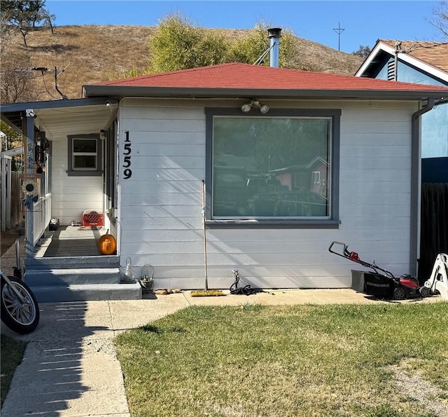 view of property exterior featuring a lawn