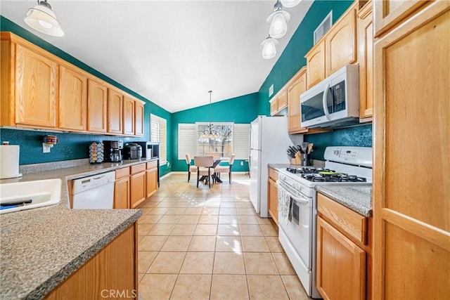 kitchen with light brown cabinetry, white appliances, light tile patterned floors, pendant lighting, and lofted ceiling