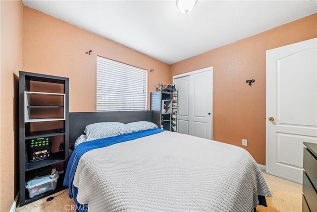 carpeted bedroom featuring a closet