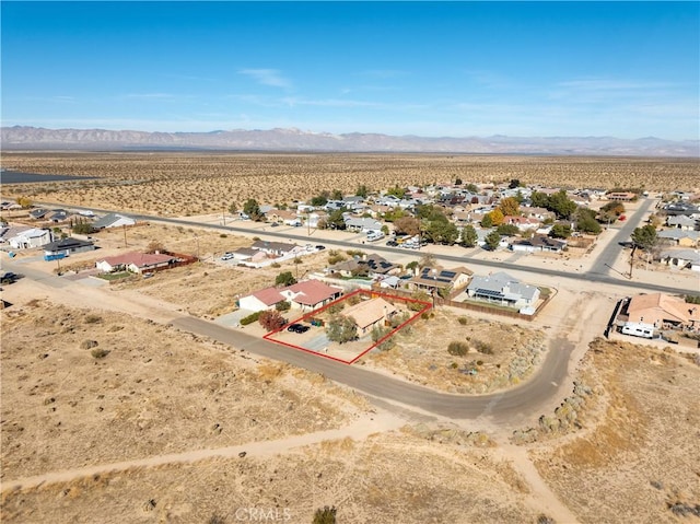 birds eye view of property featuring a mountain view