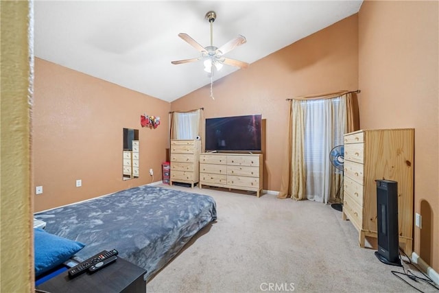 carpeted bedroom with ceiling fan and vaulted ceiling