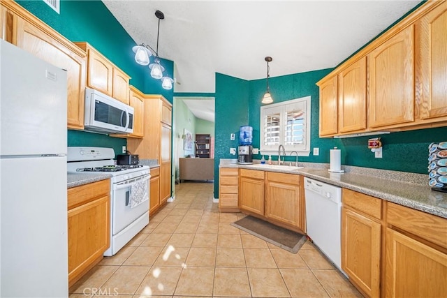 kitchen featuring light brown cabinetry, white appliances, sink, pendant lighting, and light tile patterned floors