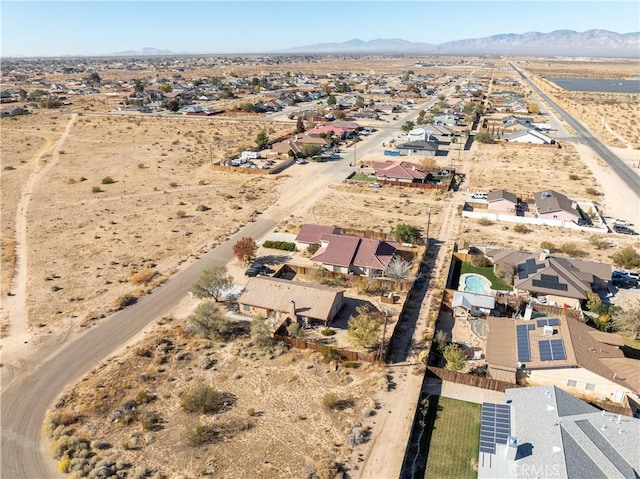 birds eye view of property featuring a mountain view