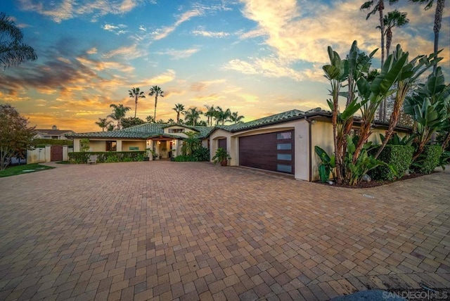 view of front of property with a garage